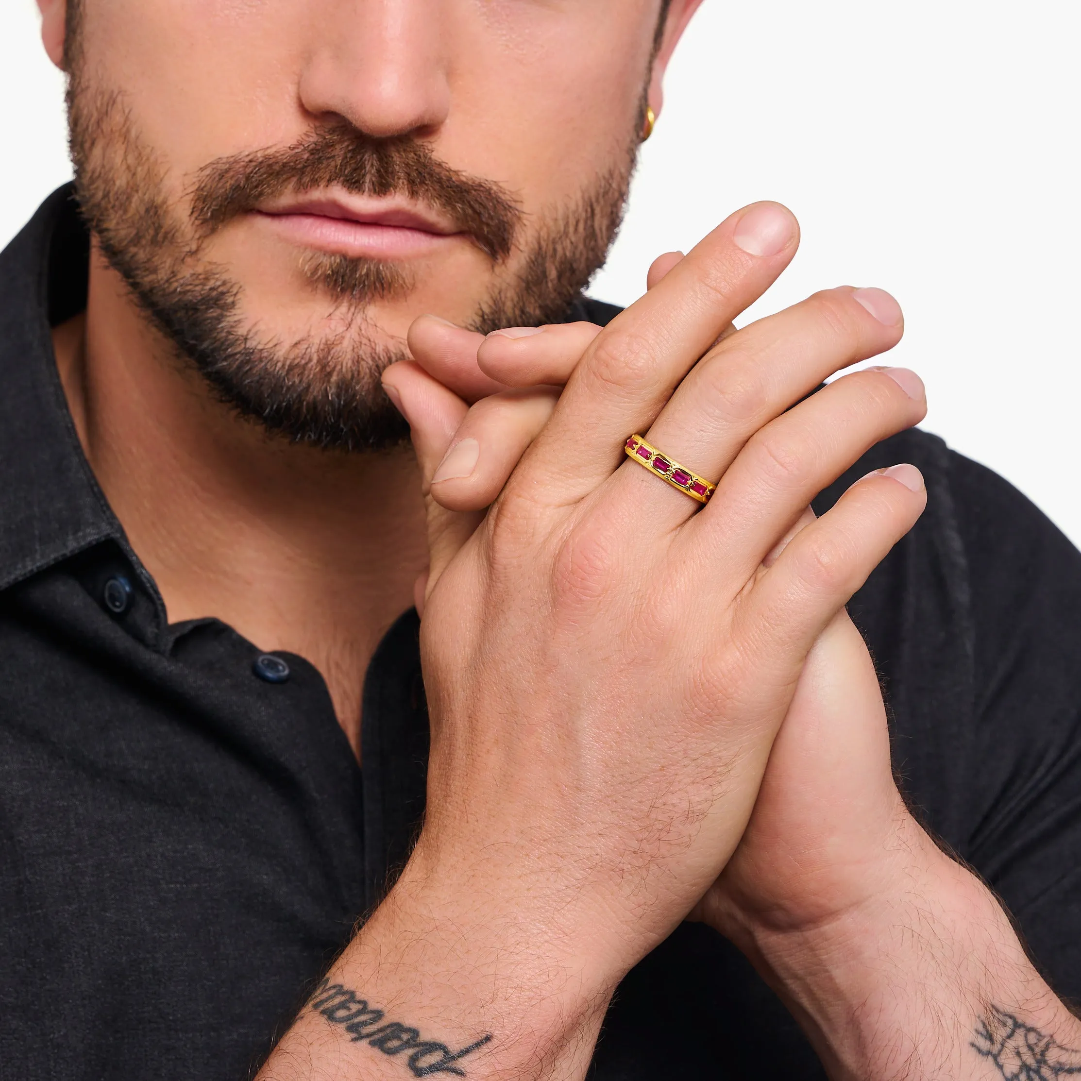 Gold plated band ring in Crocodile design with red stones